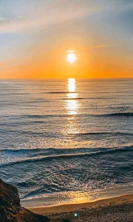 Golden sunset over San Diego ocean representing calm and transformation