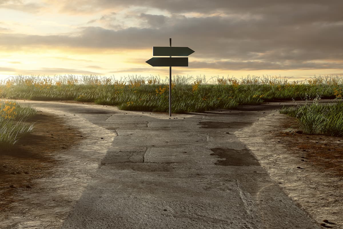 At a crossroads not knowing what to do road showing two different directions