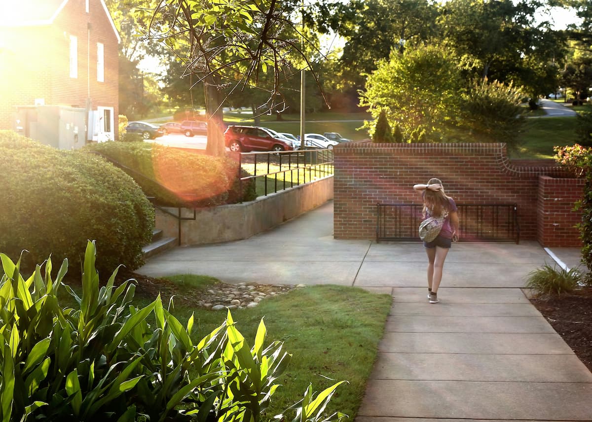woman walking in couryard - not absorbing other people's energy